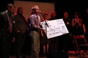 We awarded Jakey Emmert a giant check signifying his selection as our Fearless Fringe sponsorship winner.  Now my obituary can official read "he gave a giant check to a small gay man."