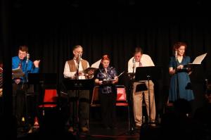 Most of the cast reading something that was, I'm sure, very very funny.  Or at least interesting.